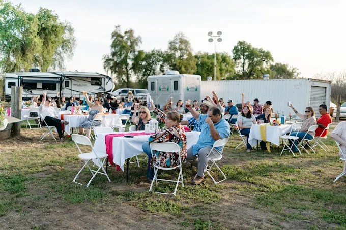 outdoor event with a porta potty from sierra sanitation in visalia ca on the background