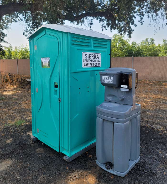 porta-potty-rentals-visalia Clean portable restroom on the background with handwashing stations for a special event in visalia, ca