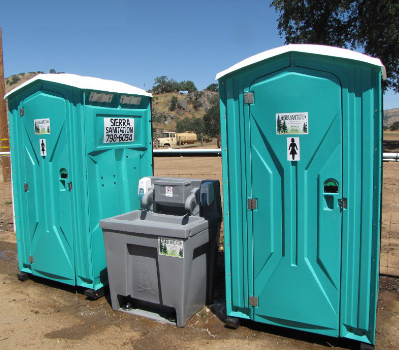 Deluxe Portable Toilet Rental with handwash station in the middle